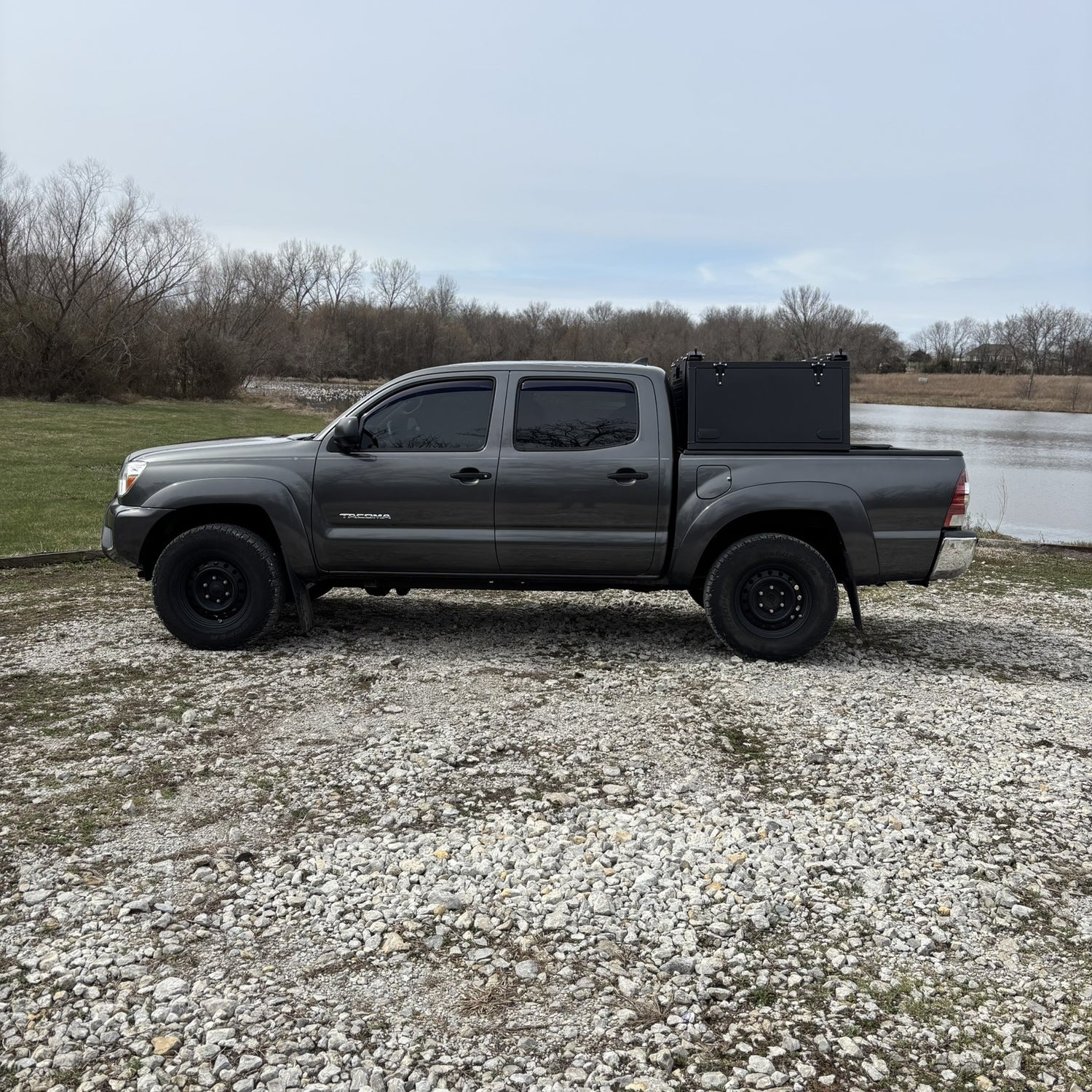 Toyota Tacoma Toolbox, overland toolbox in the woods by lake.
