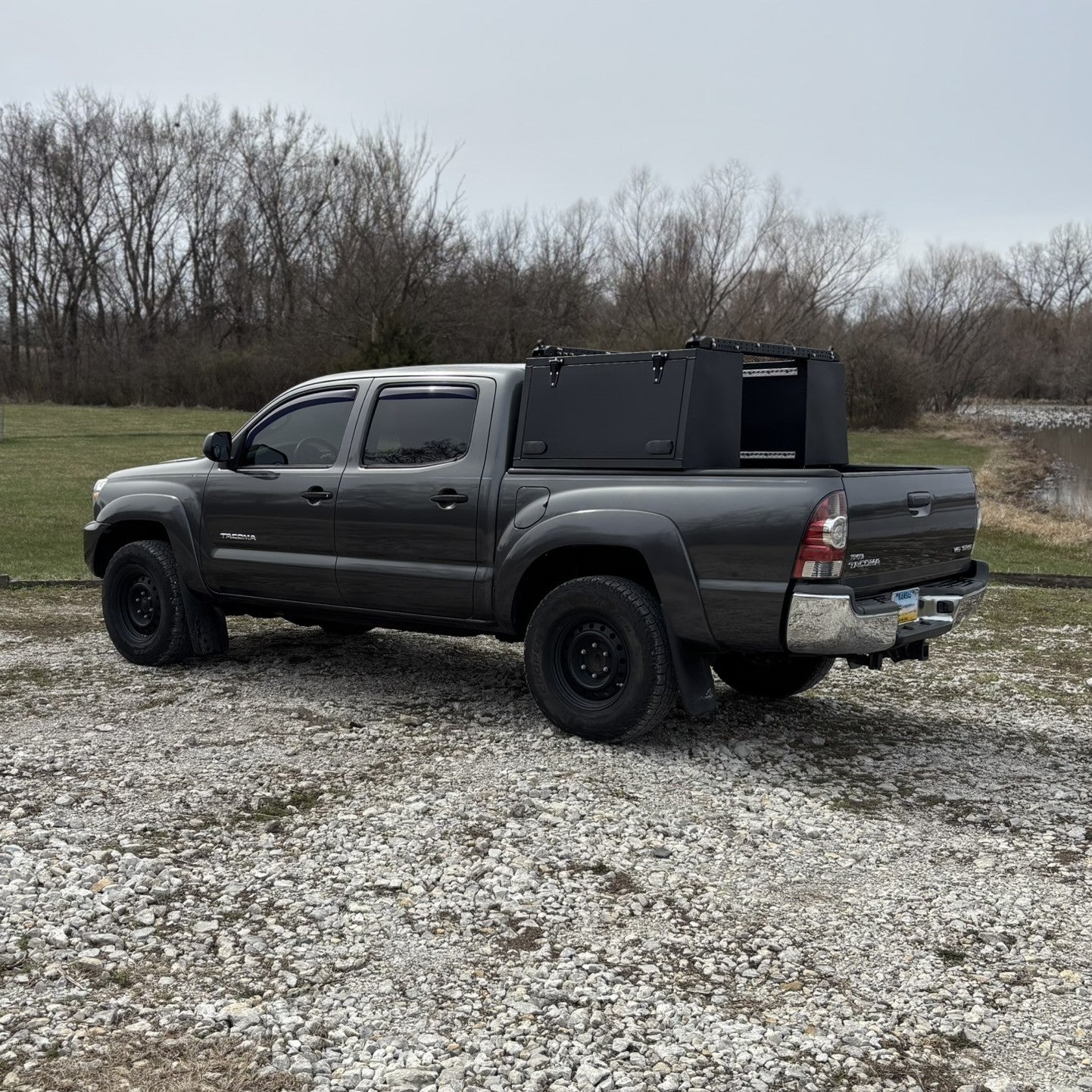 Toyota Tacoma Toolbox, overland toolbox in the woods by lake.
