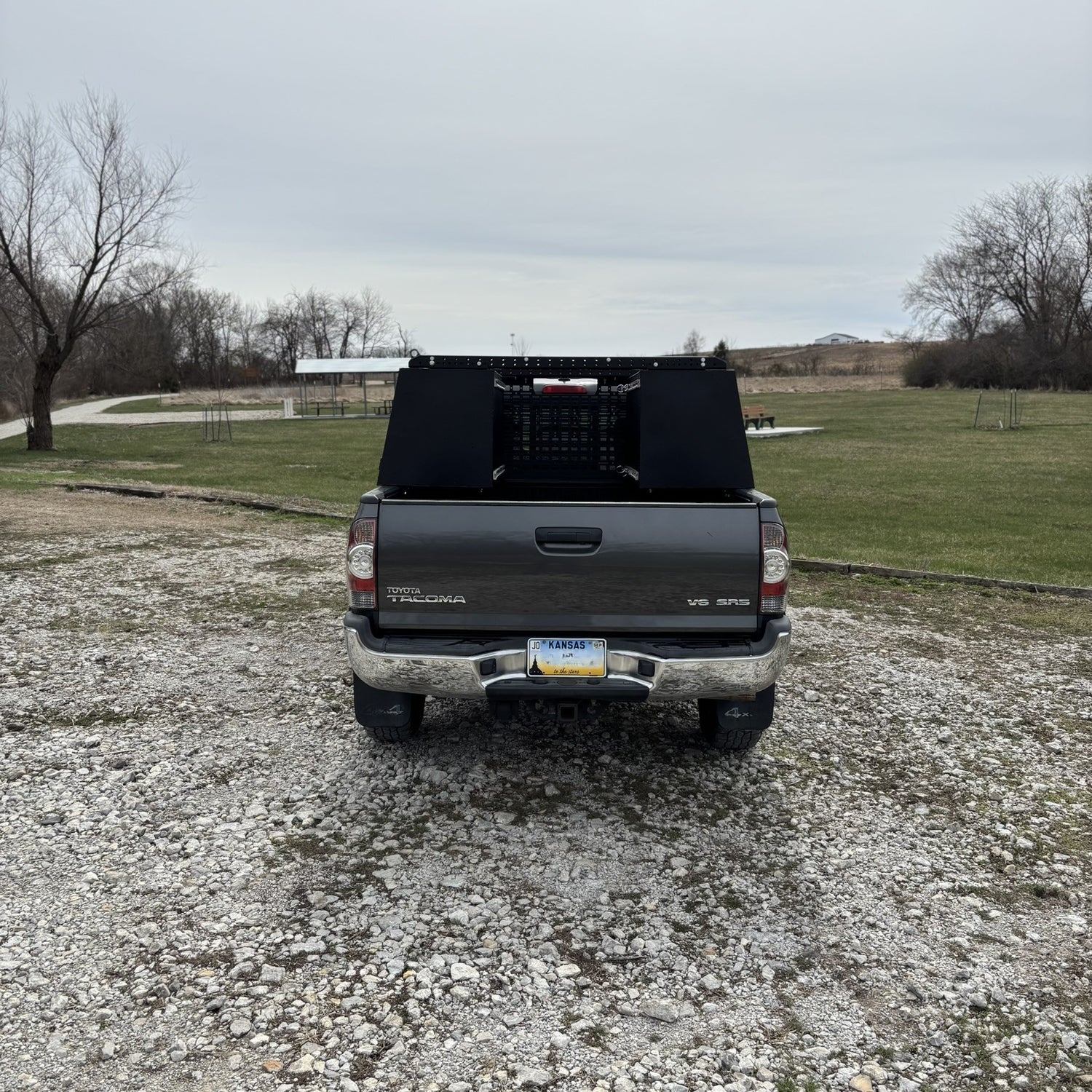 Toyota Tacoma Overland Toolbox in nature by lake
