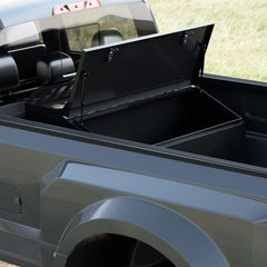 Fuel transfer tank in a Ford F350 bed with the storage chest door open